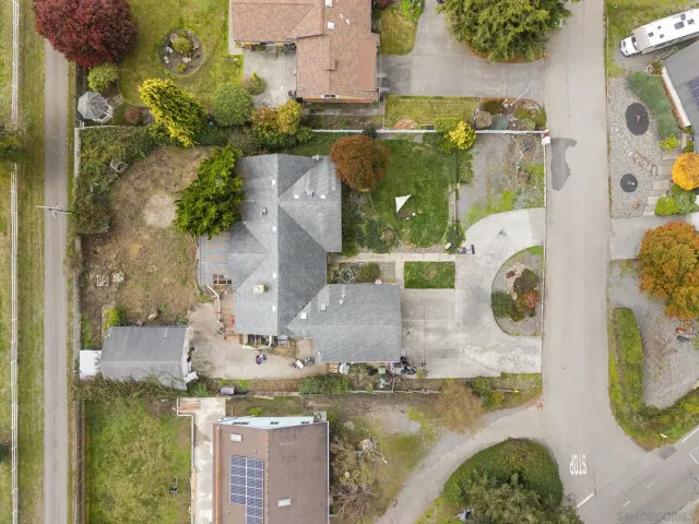 an aerial view of a house with a swimming pool