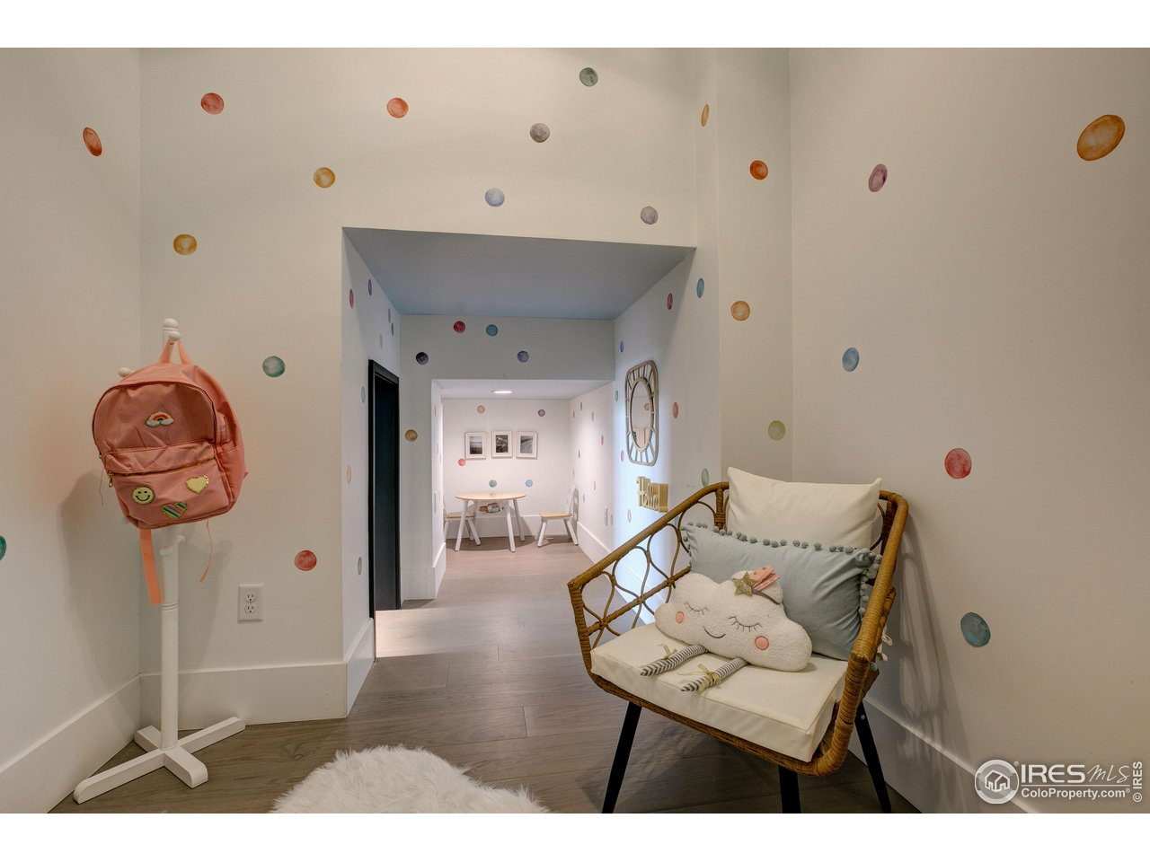 2517 Southwind Road Berthoud, CO 80513 - Photo 23 of 50 Nestled beneath the stairs, a delightful children's playroom, complete with its own Ring doorbell, creates a magical, storybook space designed for imagination and joy