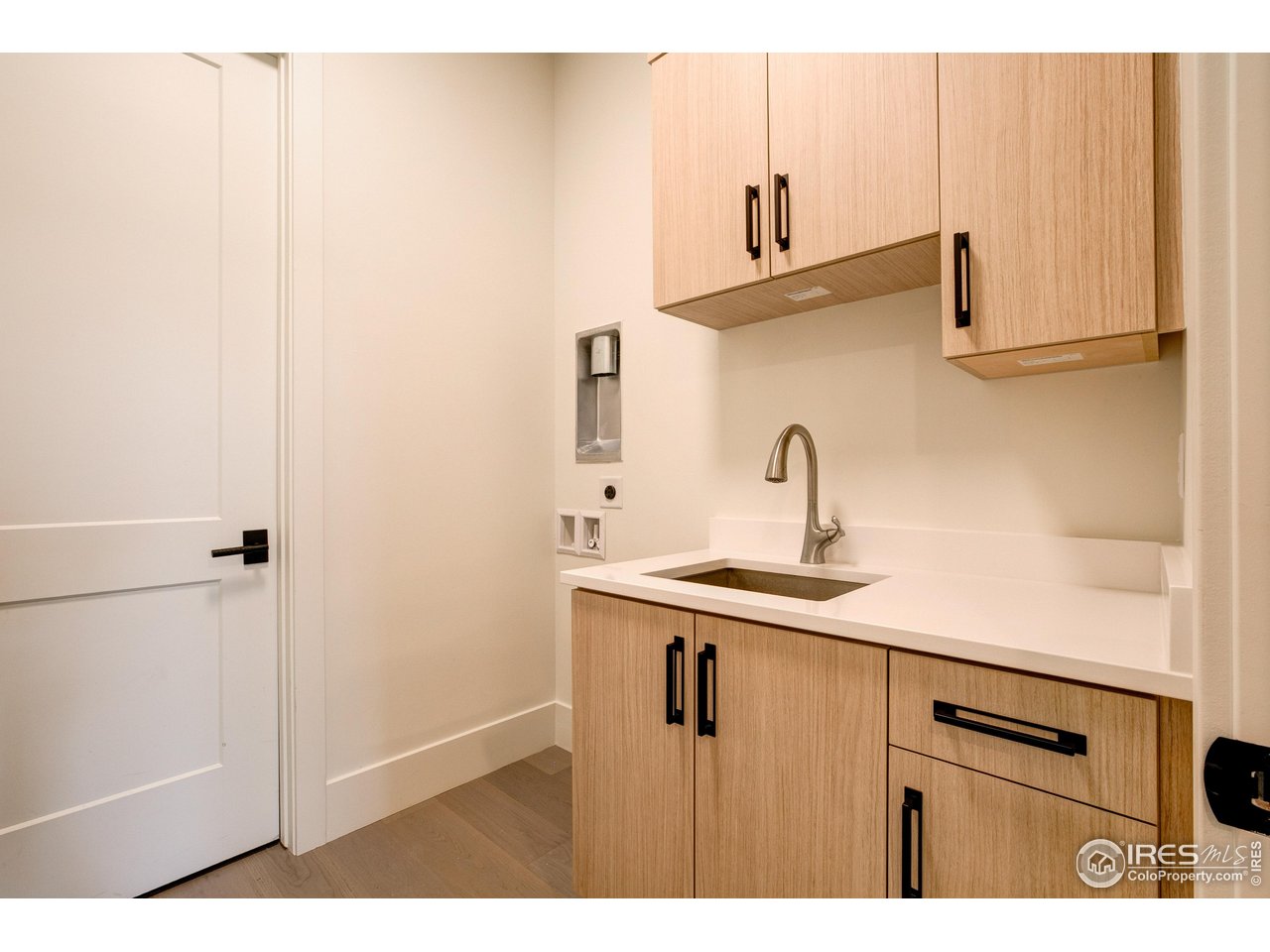 2517 Southwind Road Berthoud, CO 80513 - Photo 25 of 50 Dedicated laundry room in the basement with sink and ample storage.