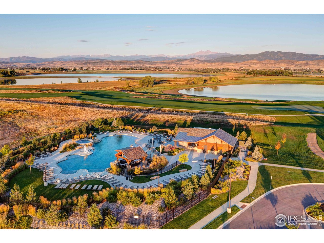 2517 Southwind Road Berthoud, CO 80513 - Photo 43 of 50 Enjoy resort-inspired summers w/ pool with a swim-up bar, offering an elevated blend of leisure and luxury.