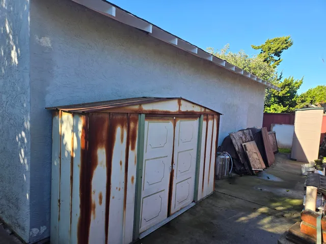 a view of kitchen with furniture and a window