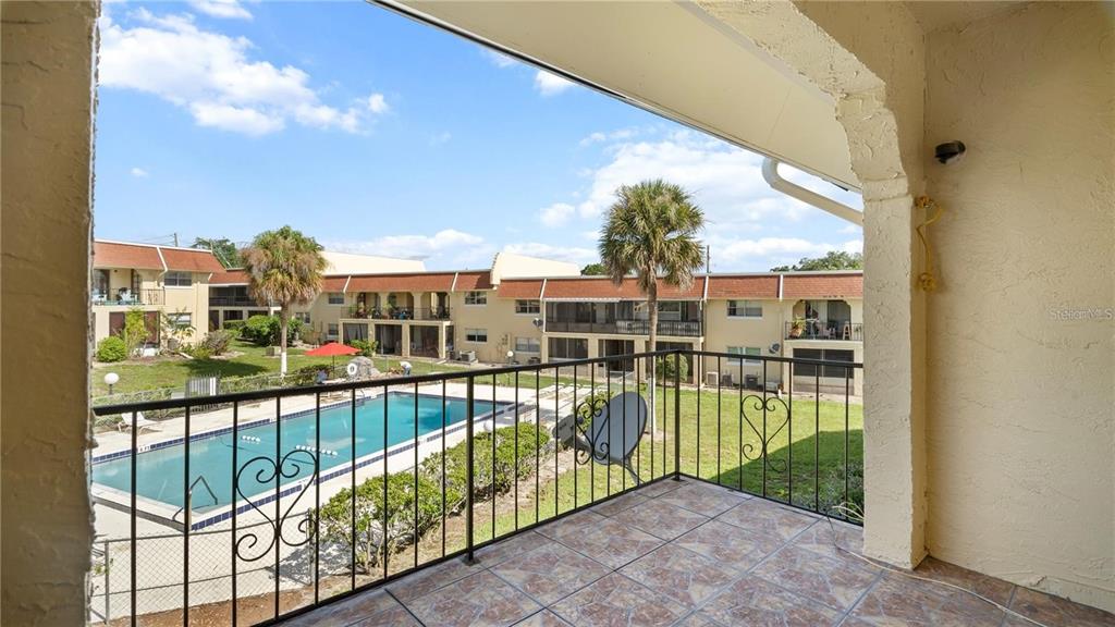106 West San Sebastian Court, Unit 106 Altamonte Springs, FL 32714 - Photo 9 of 11 a view of a building from a balcony
