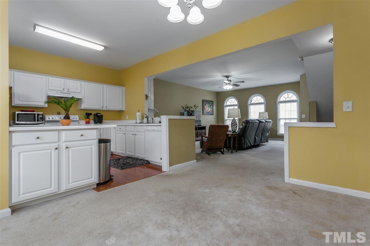 5505 Red Robin Road Raleigh, NC 27613 - Photo 2 of 19 a view of a kitchen with a sink a cabinet and windows