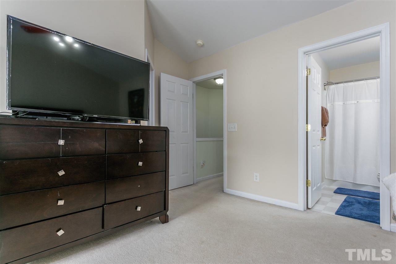 5505 Red Robin Road Raleigh, NC 27613 - Photo 11 of 19 a living room with furniture and a flat screen tv