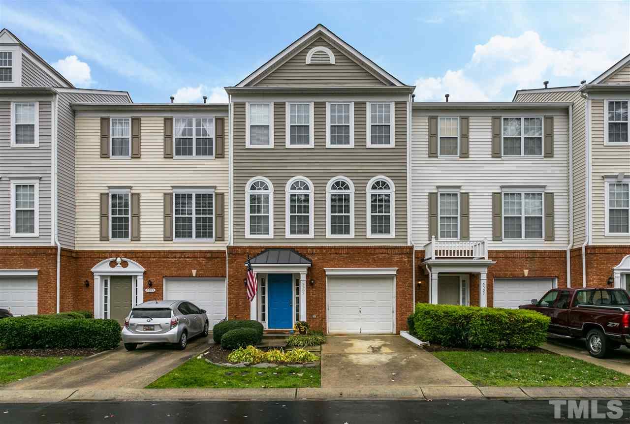 5505 Red Robin Road Raleigh, NC 27613 - Photo 14 of 19 a front view of a residential apartment building with a yard
