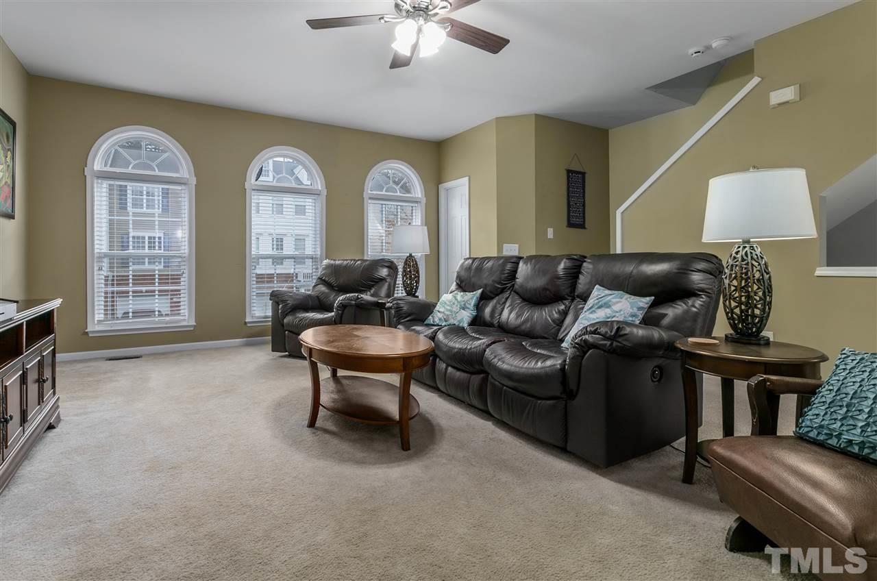 5505 Red Robin Road Raleigh, NC 27613 - Photo 6 of 19 a living room with furniture and a lamp