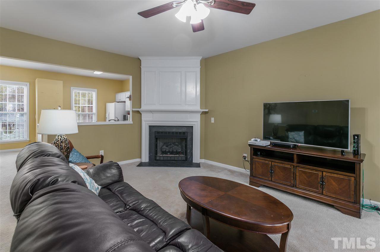 5505 Red Robin Road Raleigh, NC 27613 - Photo 7 of 19 a living room with furniture and a flat screen tv