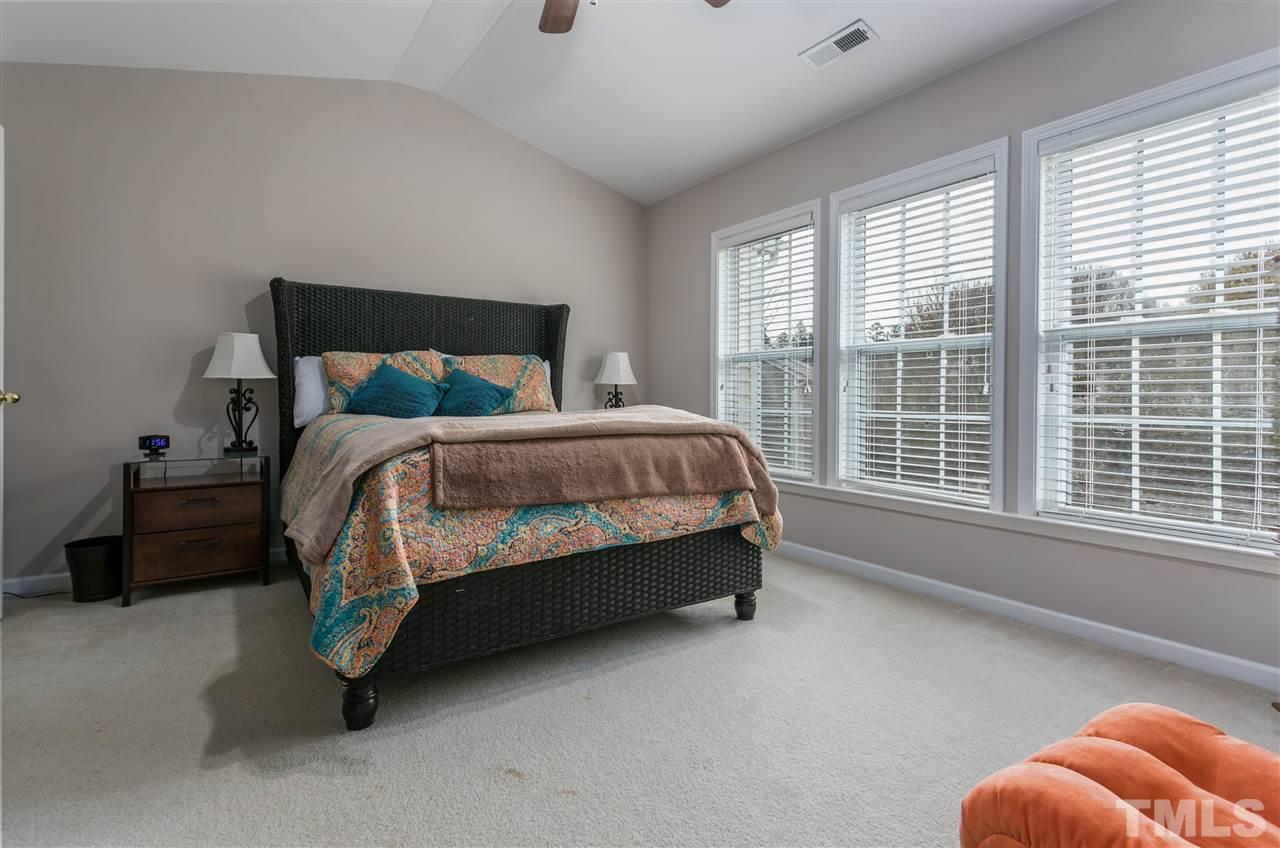 5505 Red Robin Road Raleigh, NC 27613 - Photo 8 of 19 a bed sitting in a room next to a window