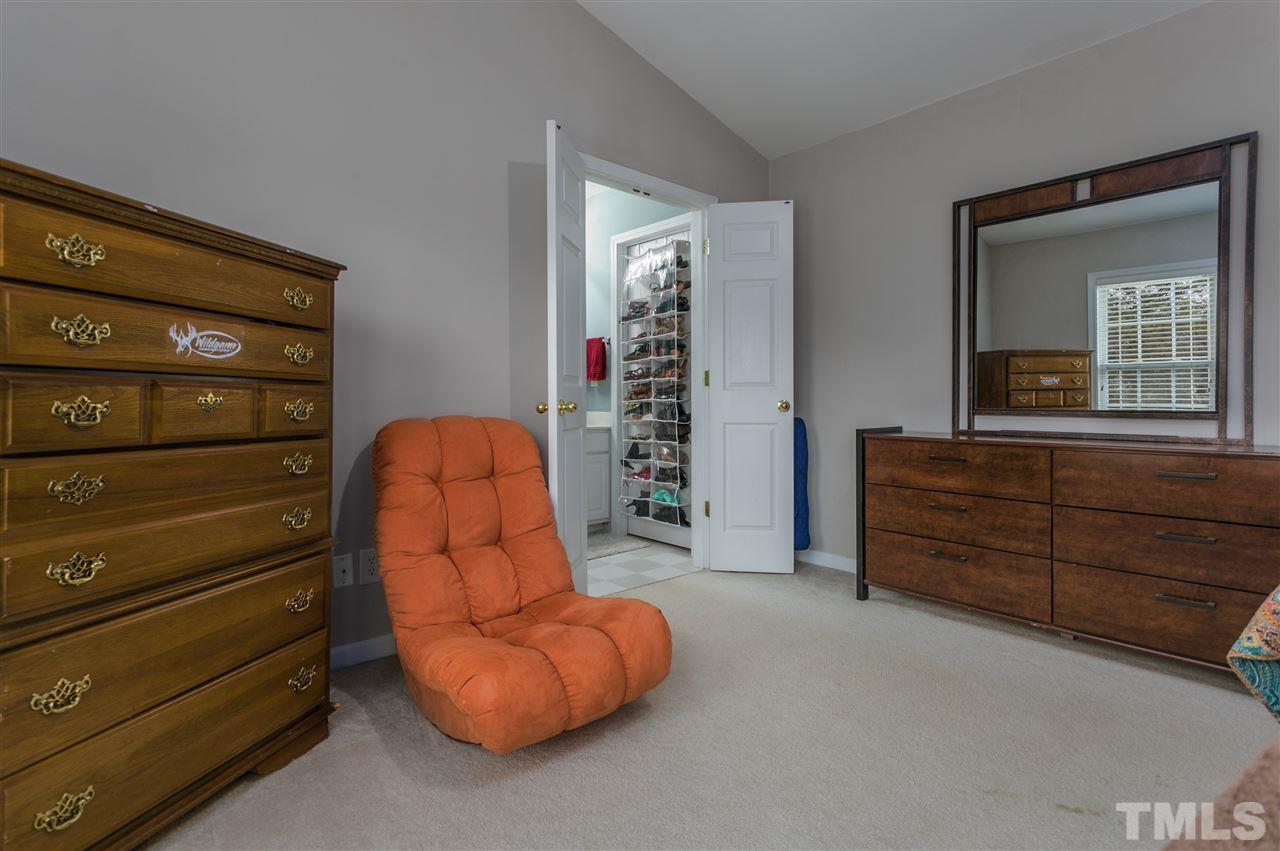 5505 Red Robin Road Raleigh, NC 27613 - Photo 9 of 19 a living room with furniture and dresser