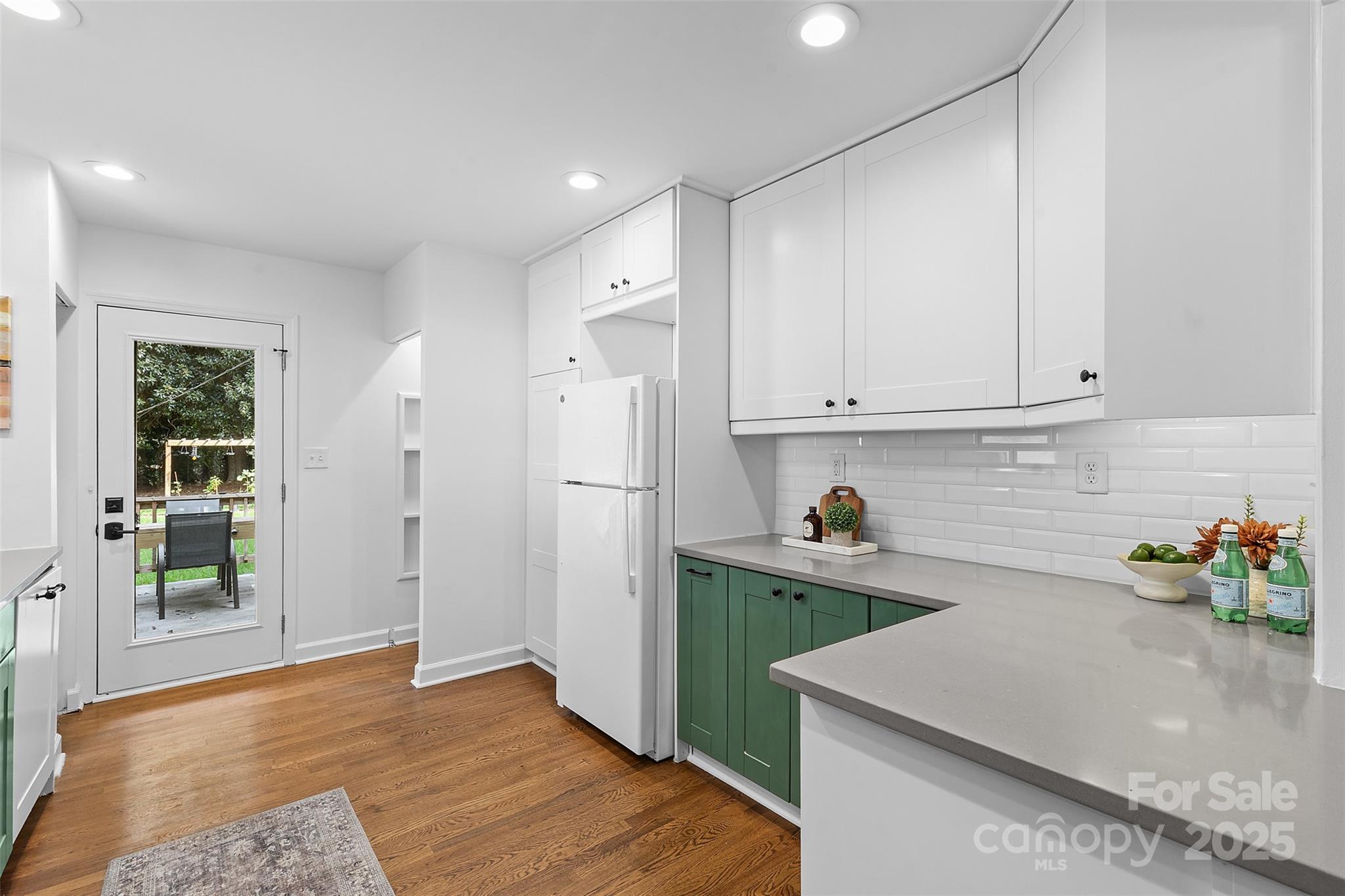 917 Scaleybark Road Charlotte, NC 28209 - Photo 15 of 42 a kitchen that has a lot of cabinets and wooden floor