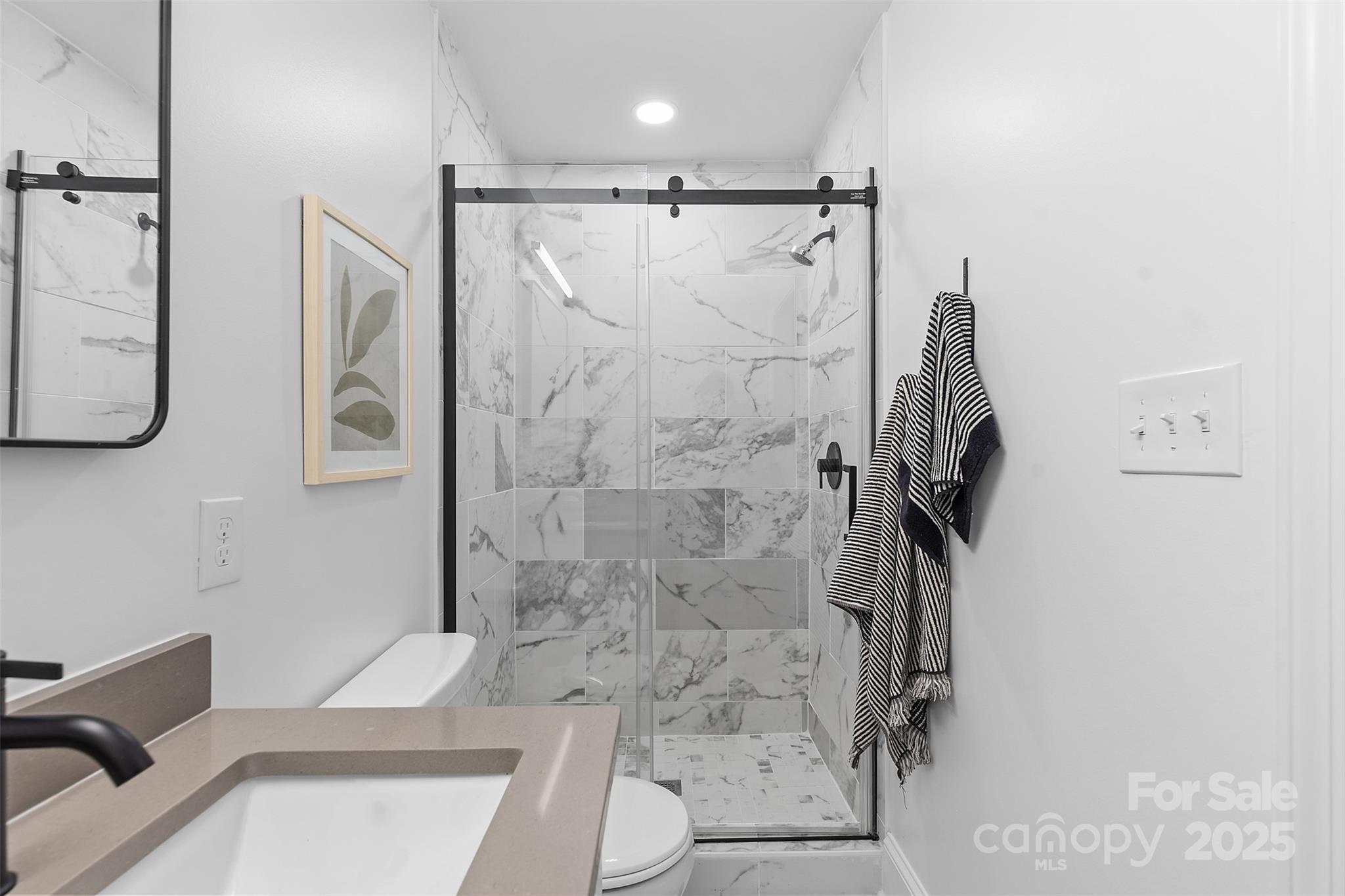 917 Scaleybark Road Charlotte, NC 28209 - Photo 23 of 42 a bathroom with a shower toilet and tub
