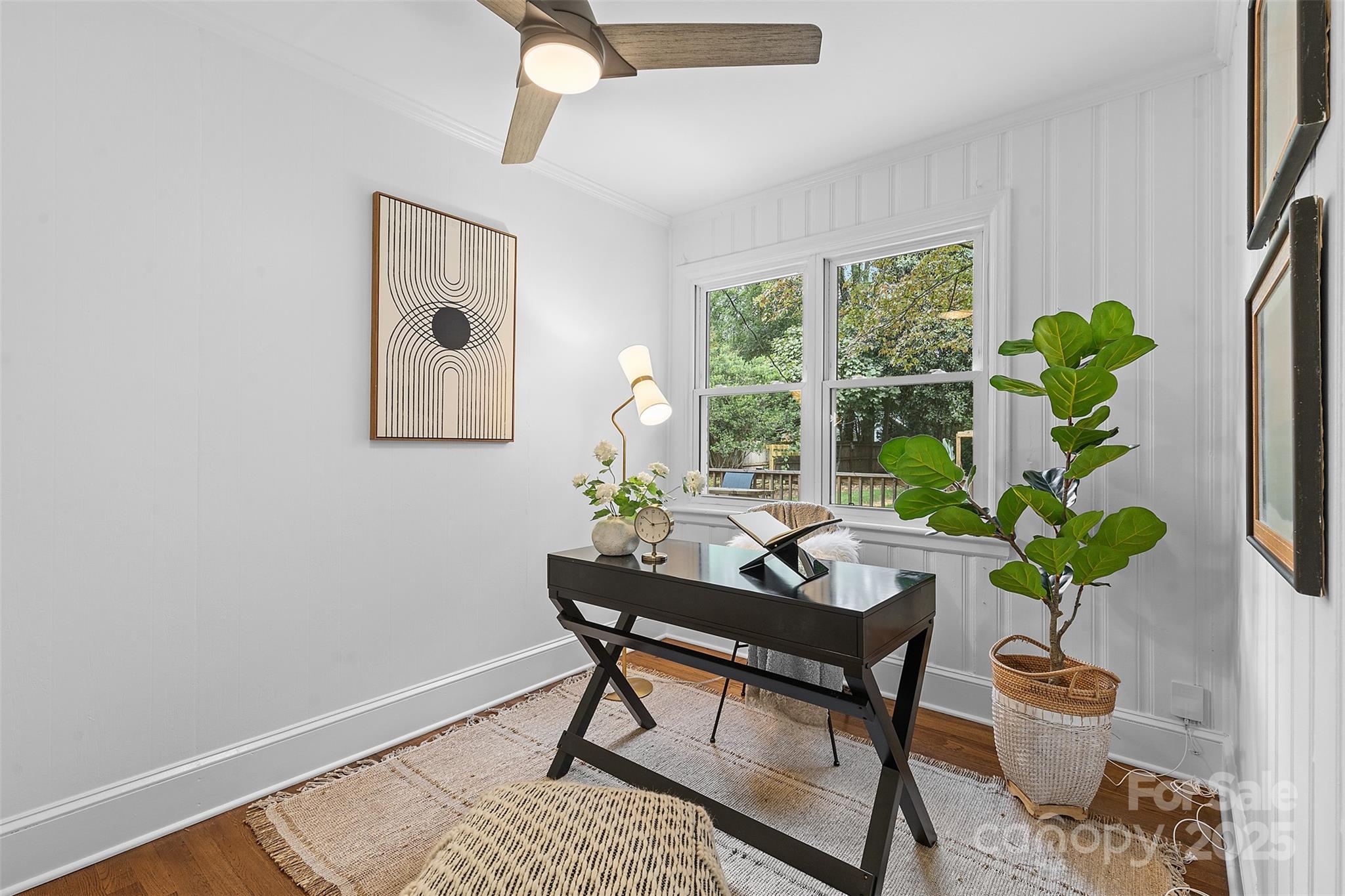 917 Scaleybark Road Charlotte, NC 28209 - Photo 24 of 42 a workspace with furniture and a potted plant
