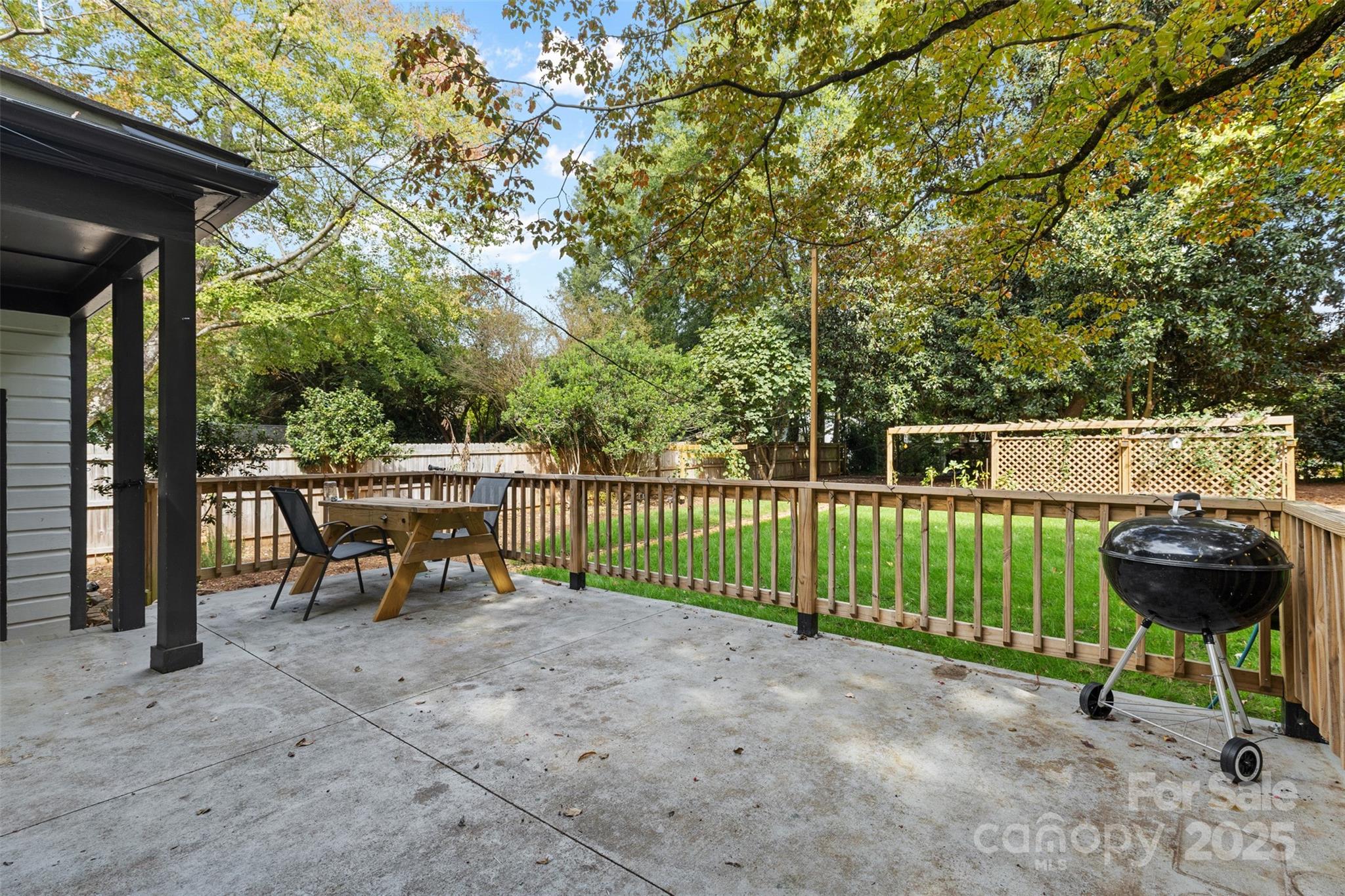 917 Scaleybark Road Charlotte, NC 28209 - Photo 29 of 42 a view of a chairs and table in the back yard of the house
