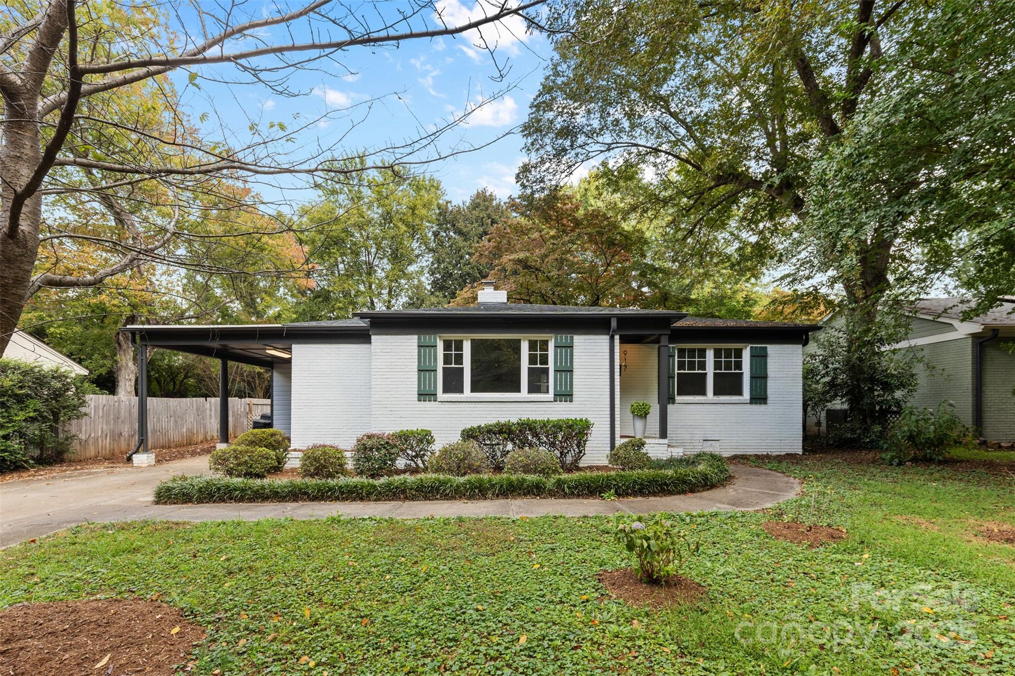 917 Scaleybark Road Charlotte, NC 28209 - Photo 40 of 42 a front view of a house with garden