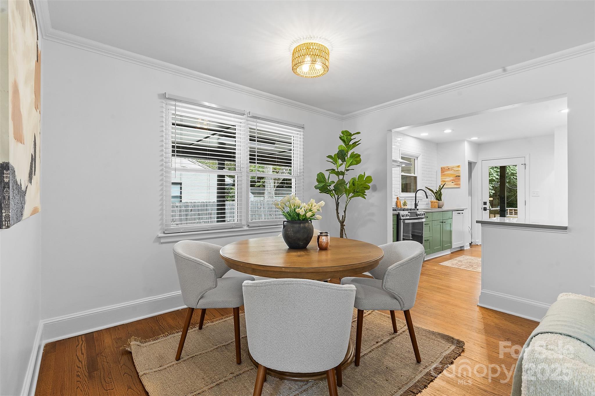 917 Scaleybark Road Charlotte, NC 28209 - Photo 6 of 42 a dining room with furniture and wooden floor