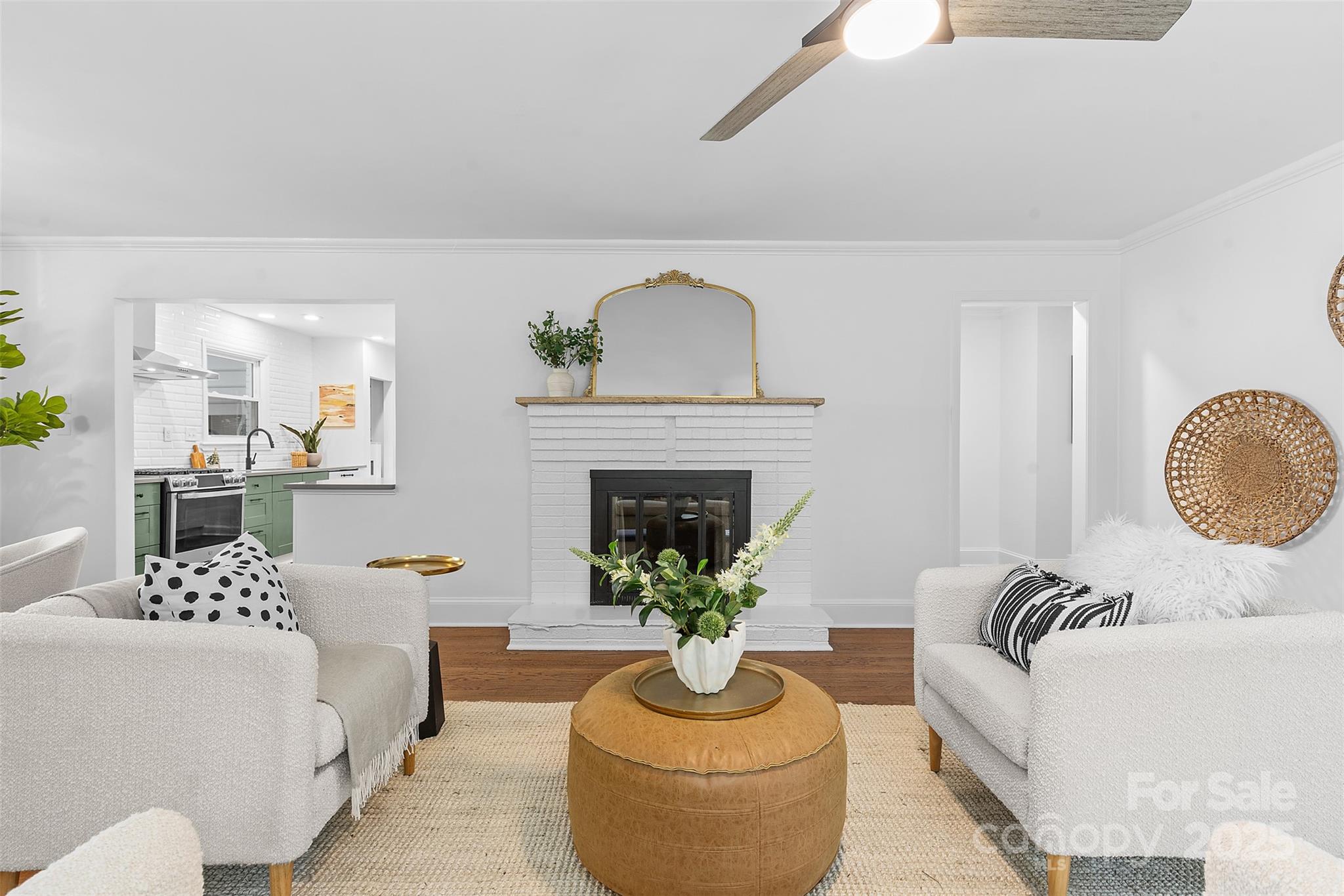 917 Scaleybark Road Charlotte, NC 28209 - Photo 7 of 42 a living room with furniture a fireplace and a potted plant