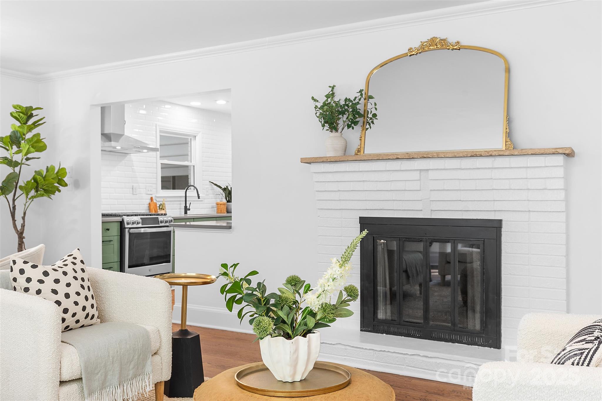 917 Scaleybark Road Charlotte, NC 28209 - Photo 9 of 42 a living room with furniture and a fireplace