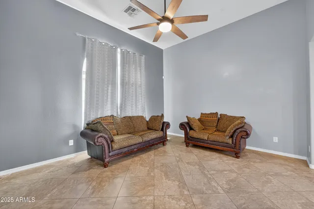 a living room with furniture and a window
