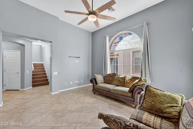 a living room with furniture and a rug