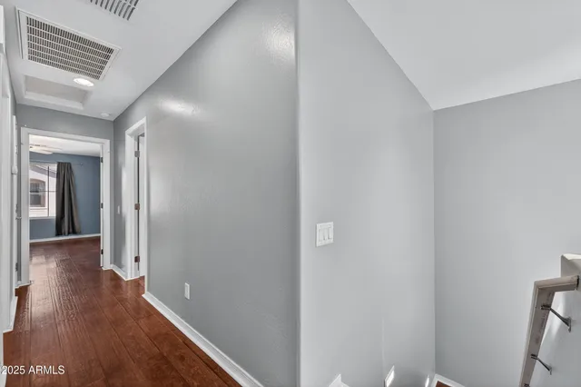 a bathroom with a granite countertop sink toilet and a mirror