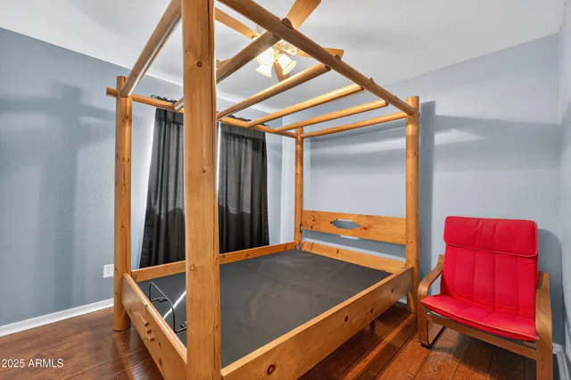 a view of a livingroom with a ceiling fan and window