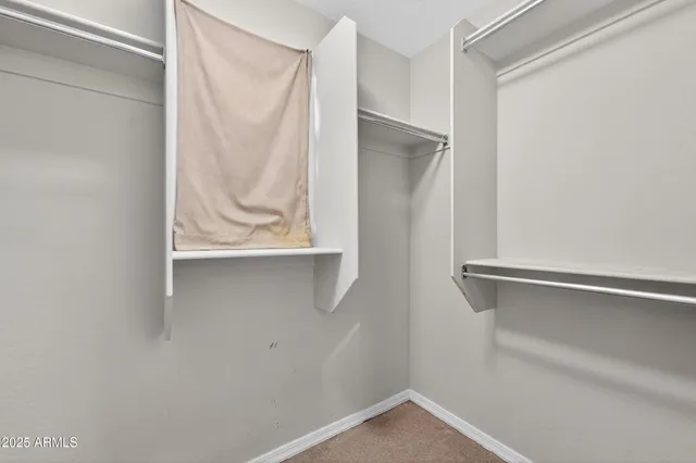 a view of storage and utility room with washer and dryer
