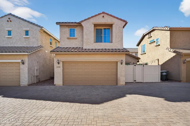 a view of a hallway with a door and stairs