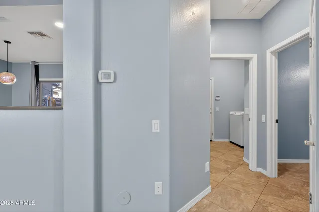 a kitchen with stainless steel appliances granite countertop a sink stove refrigerator and cabinets