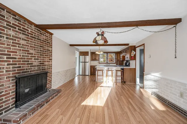 a view of a living room a fireplace with wooden floor