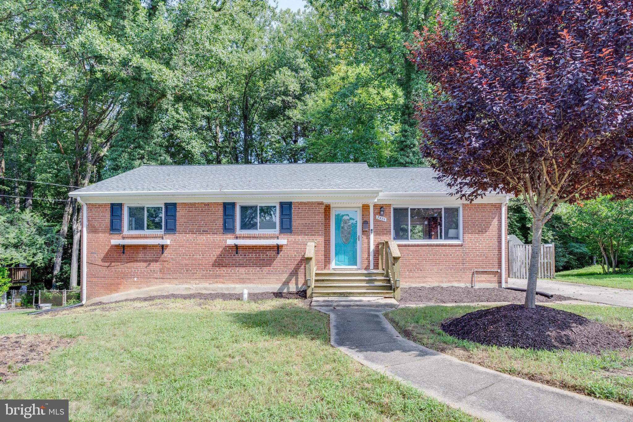 7424 Nancemond Street Springfield, VA 22150 - Photo 3 of 59 front view of a house with a yard