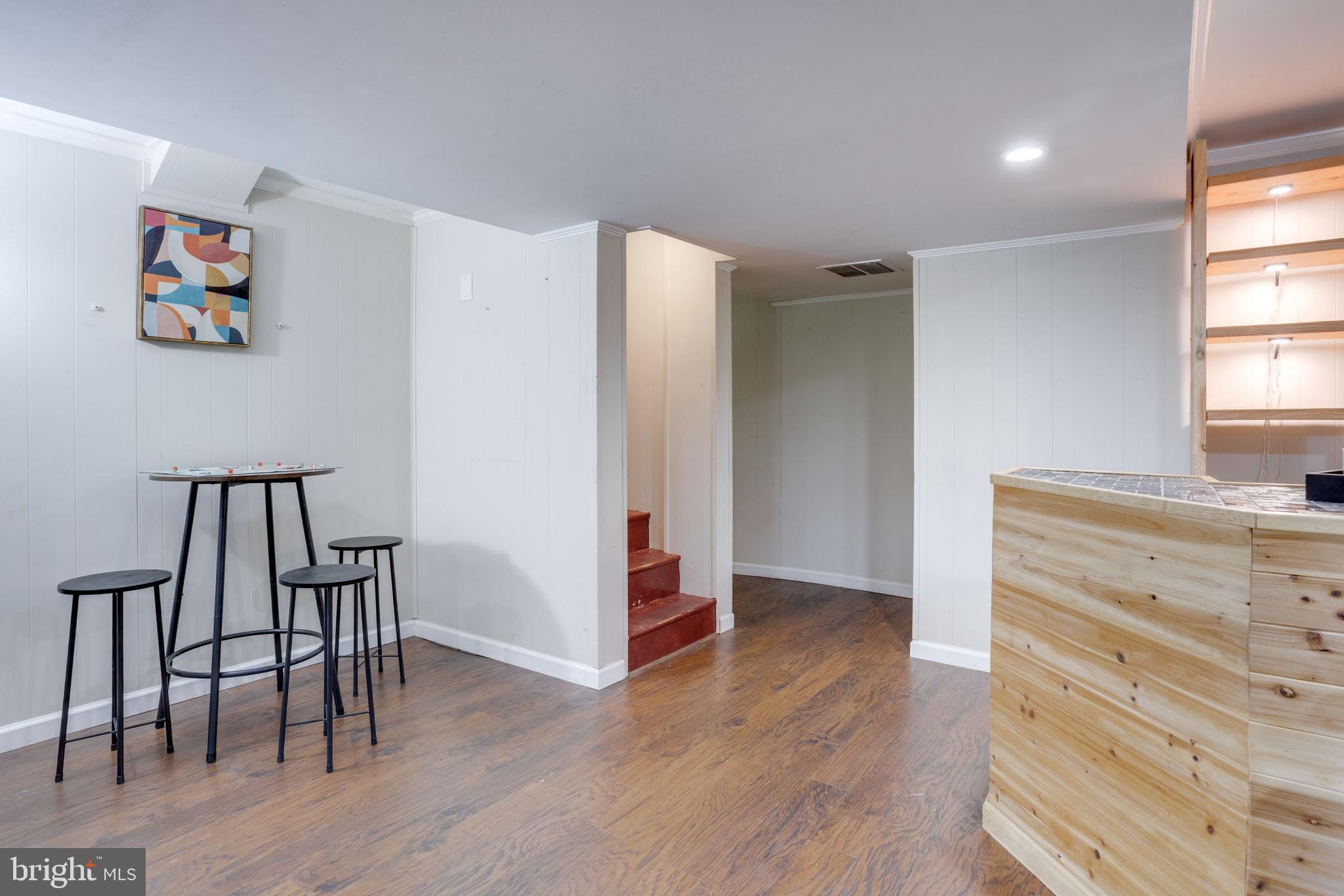 7424 Nancemond Street Springfield, VA 22150 - Photo 31 of 59 a view of a hallway with wooden floor and windows