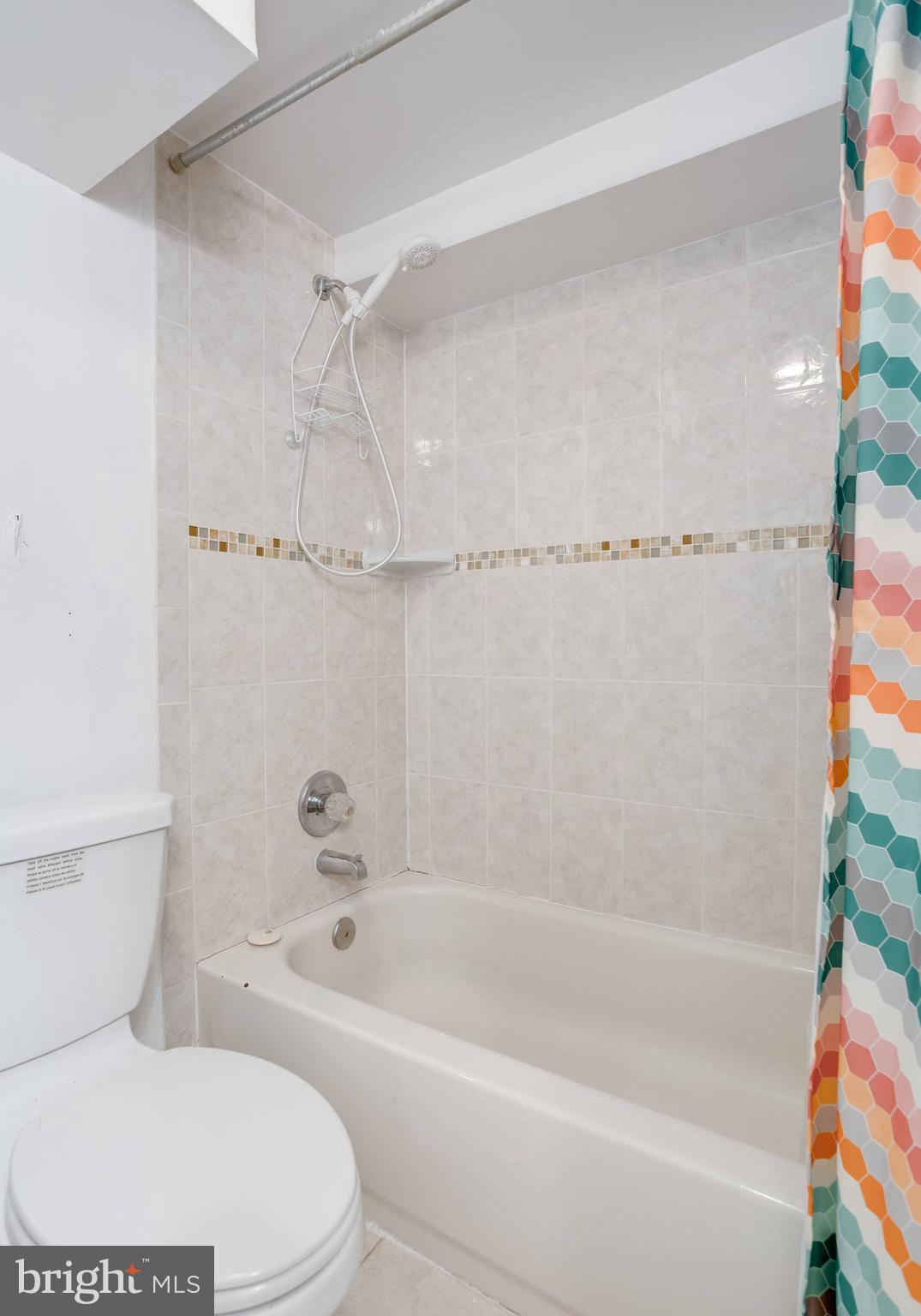 7424 Nancemond Street Springfield, VA 22150 - Photo 33 of 59 a bathroom with a toilet and a bathtub