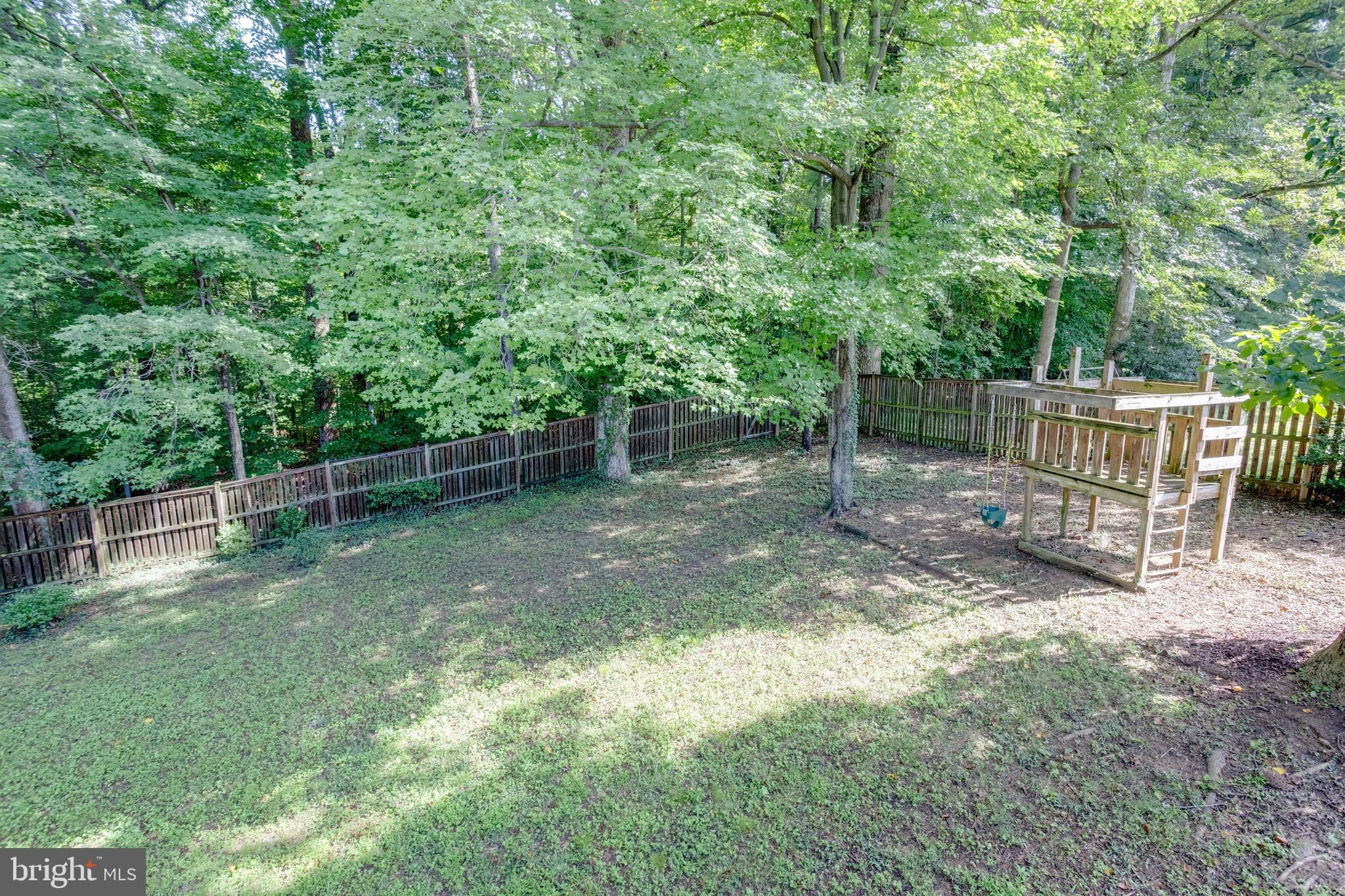 7424 Nancemond Street Springfield, VA 22150 - Photo 38 of 59 a backyard of a house with lots of green space