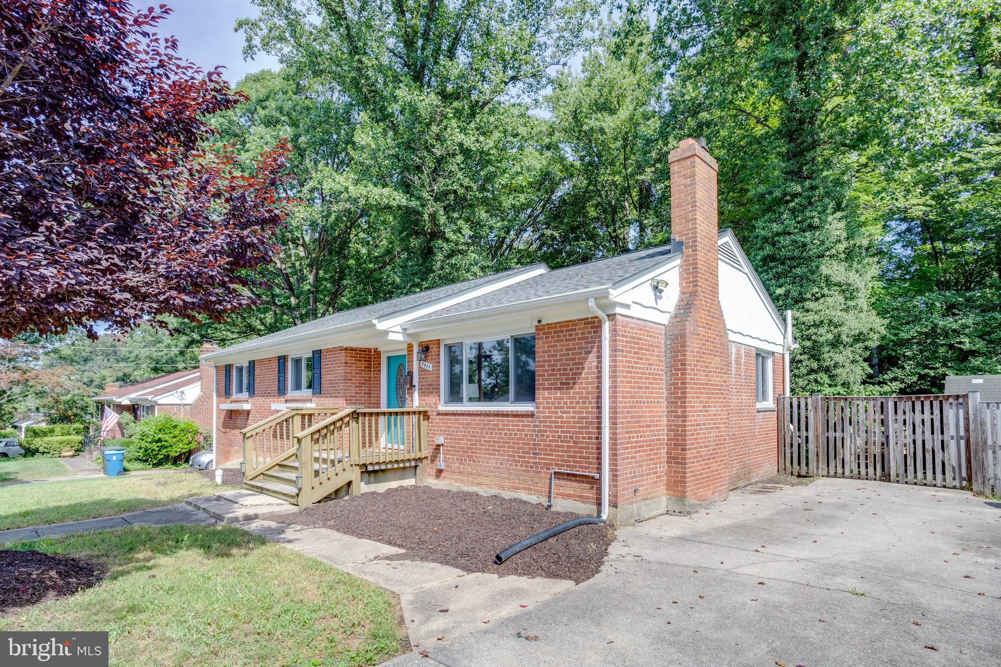 7424 Nancemond Street Springfield, VA 22150 - Photo 44 of 59 a view of a house with backyard and trees