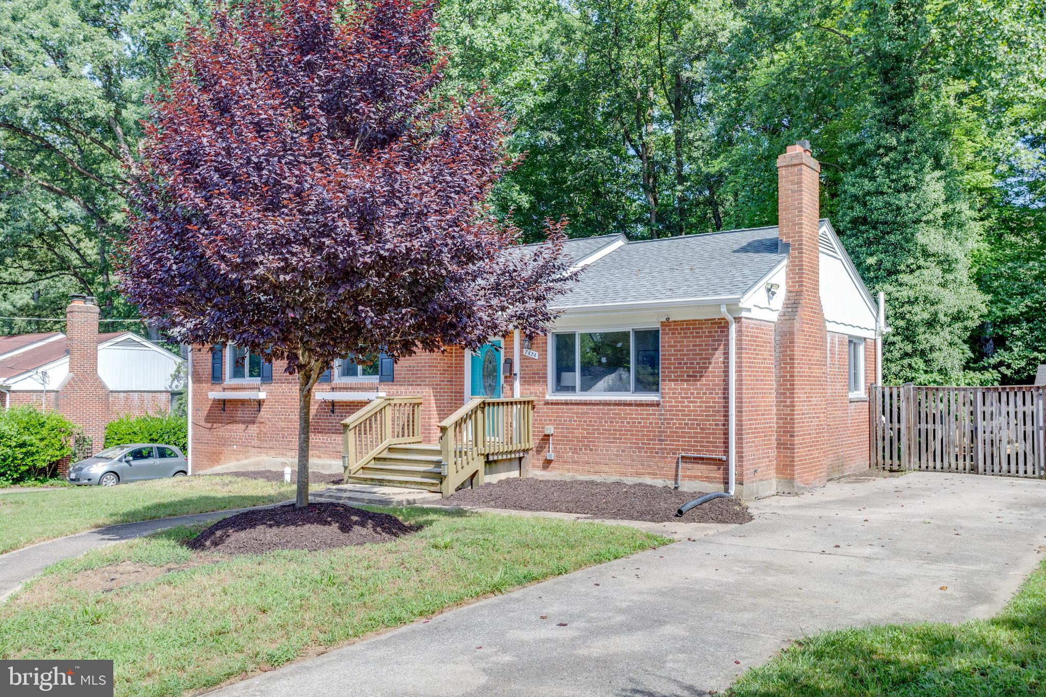 7424 Nancemond Street Springfield, VA 22150 - Photo 45 of 59 a front view of a house with garden