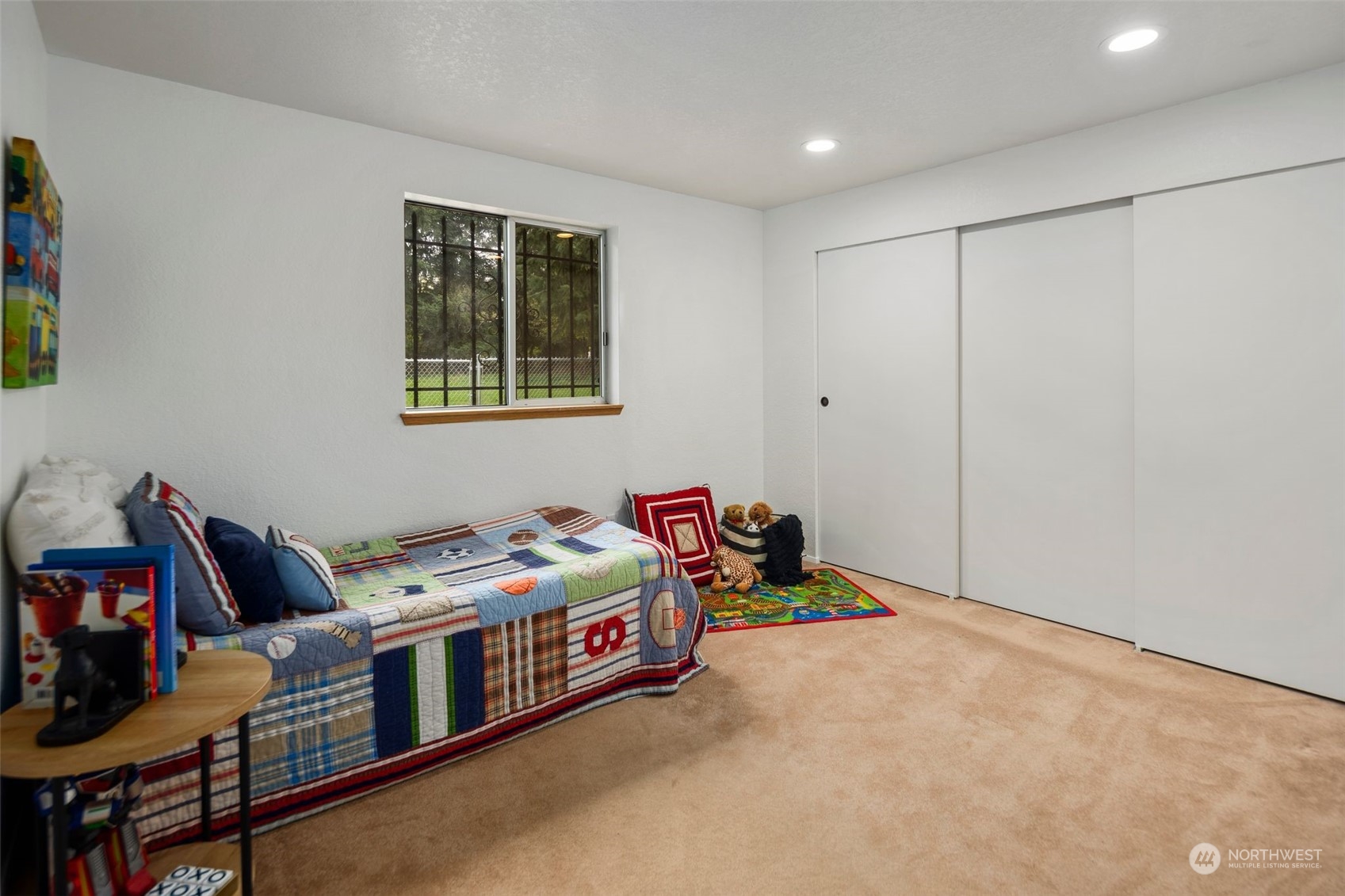 14844 Southeast 116th Street Renton, WA 98059 - Photo 13 of 38 a bedroom with bed and a window