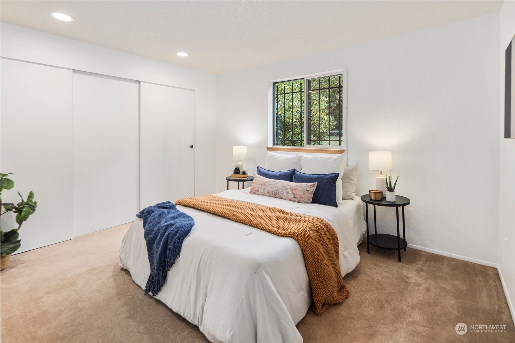 14844 Southeast 116th Street Renton, WA 98059 - Photo 14 of 38 a bedroom with a bed and a window