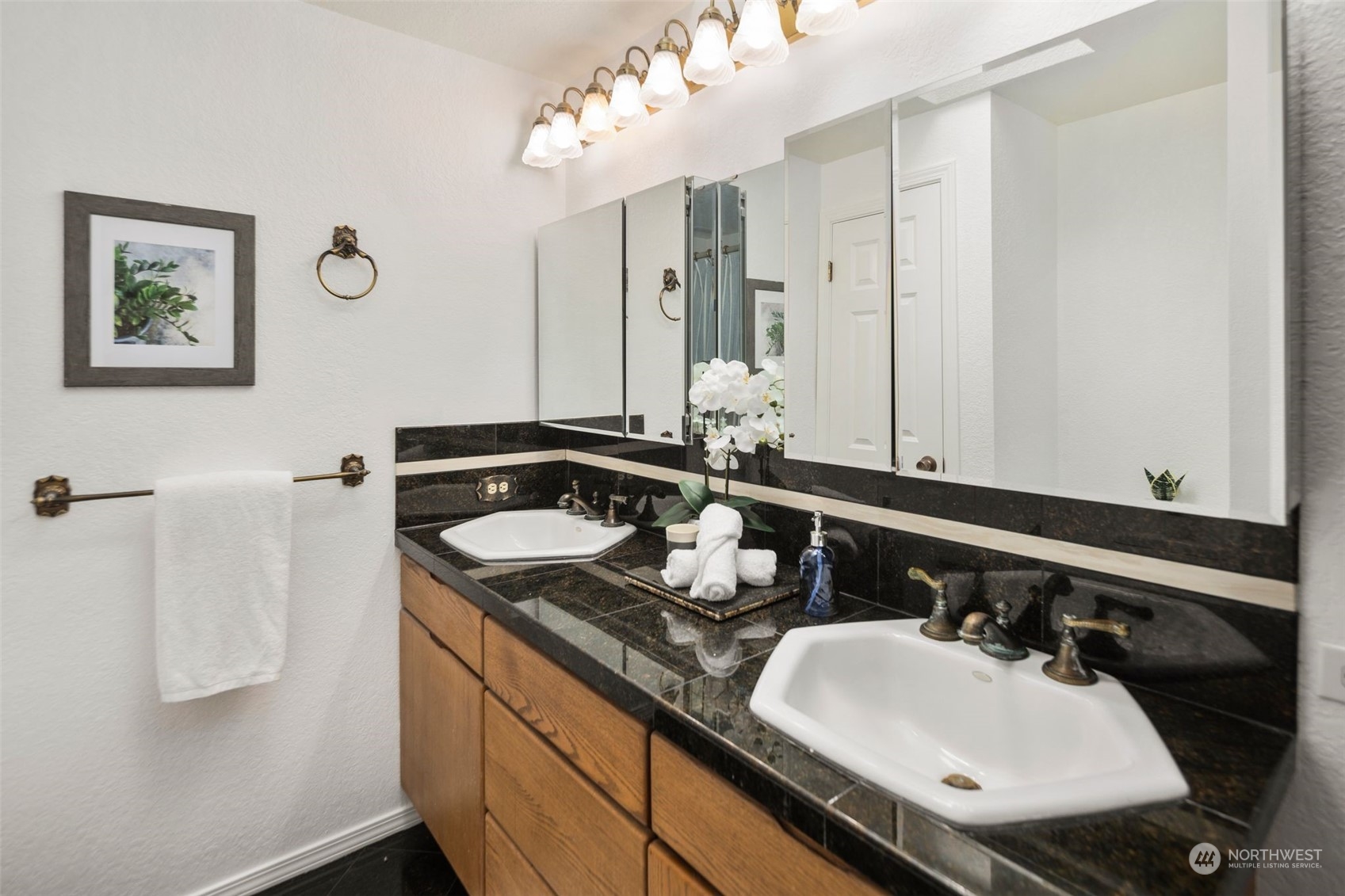 14844 Southeast 116th Street Renton, WA 98059 - Photo 18 of 38 a bathroom with a sink and a mirror