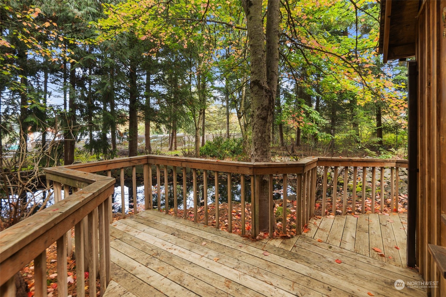 14844 Southeast 116th Street Renton, WA 98059 - Photo 24 of 38 a view of balcony with wooden floor and fence