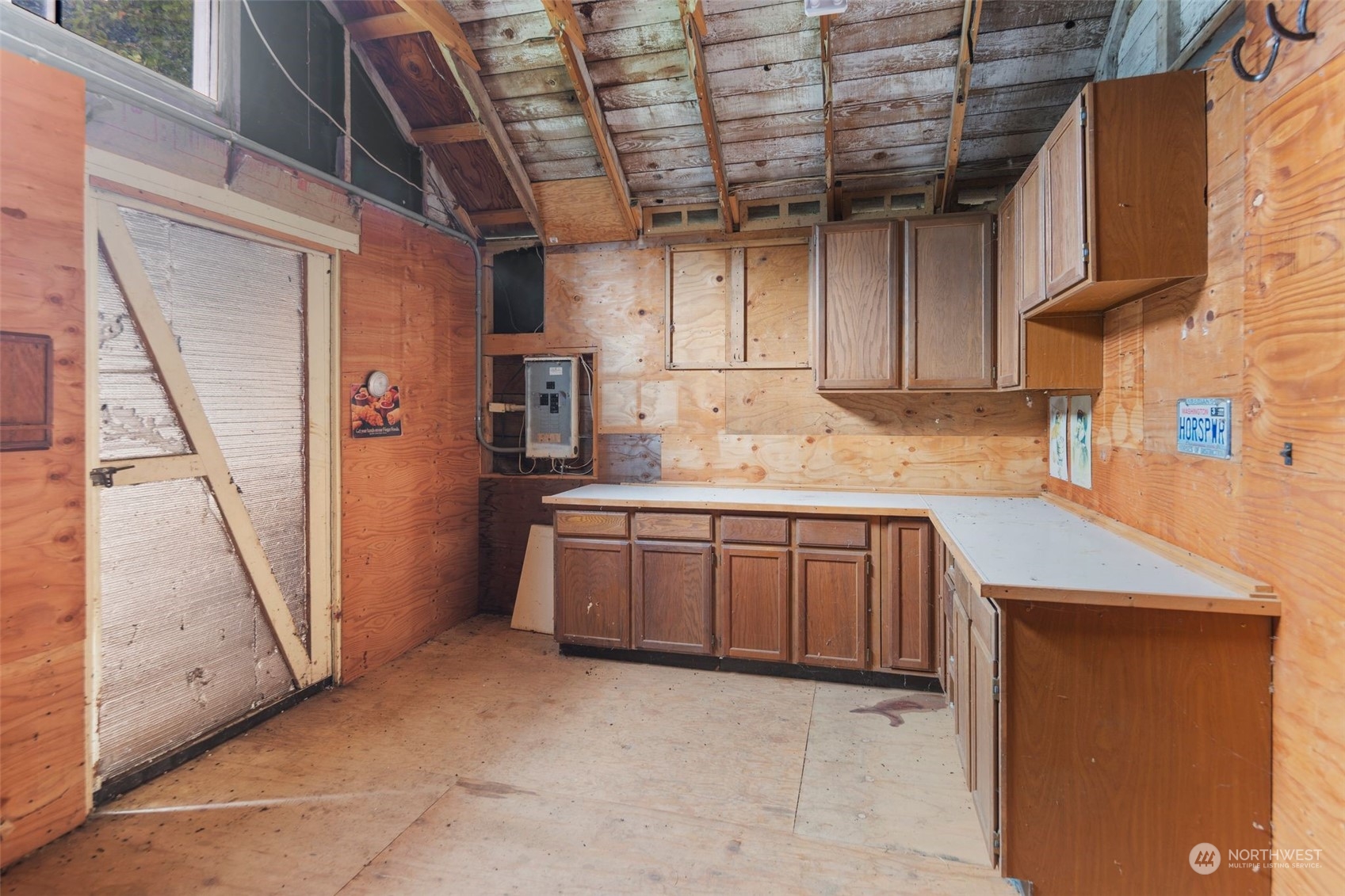 14844 Southeast 116th Street Renton, WA 98059 - Photo 27 of 38 a kitchen with a sink a refrigerator and cabinets