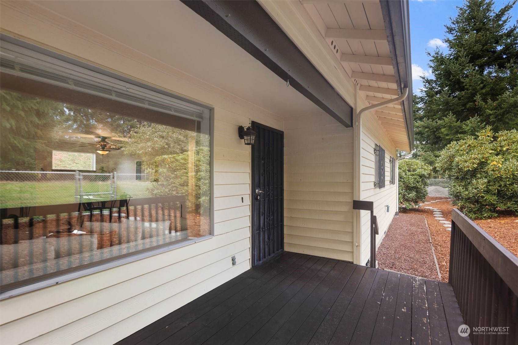 14844 Southeast 116th Street Renton, WA 98059 - Photo 3 of 38 a view of a balcony with wooden floor and fence
