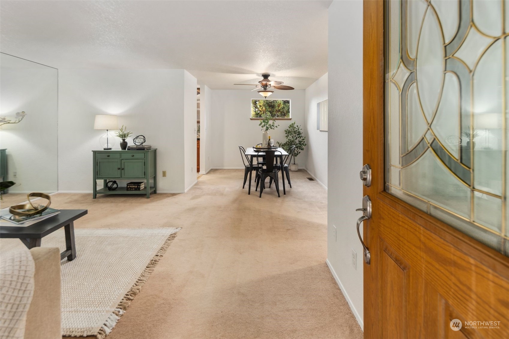 14844 Southeast 116th Street Renton, WA 98059 - Photo 4 of 38 a living room with furniture and a table