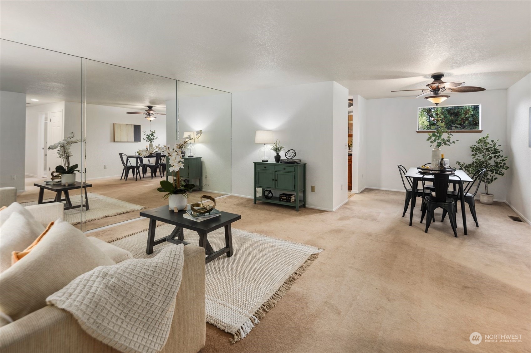 14844 Southeast 116th Street Renton, WA 98059 - Photo 5 of 38 a living room with furniture a dining table and chairs