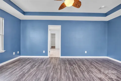 a view of room with wooden floor