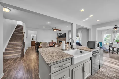 a view of kitchen with sink and living room