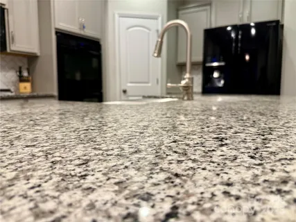 a view of a bathroom with sink and mirror