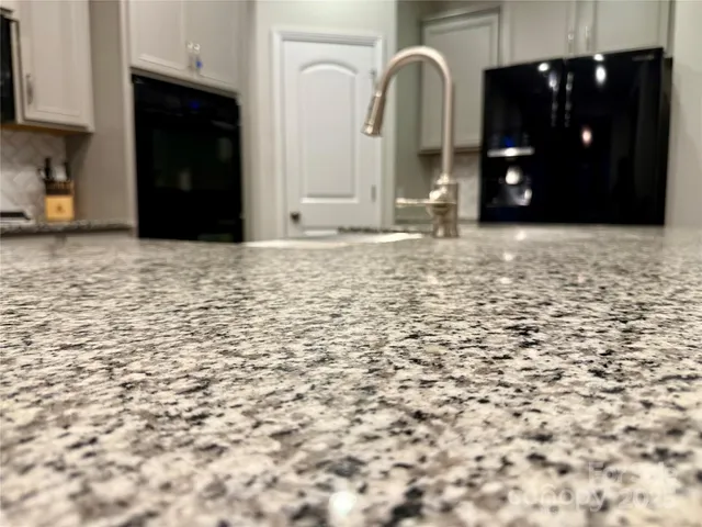 a view of a bathroom with sink and mirror
