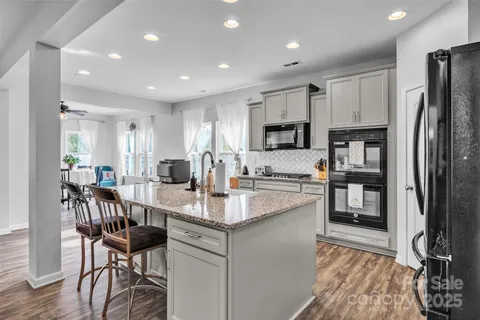 a kitchen with counter top space cabinets and stainless steel appliances