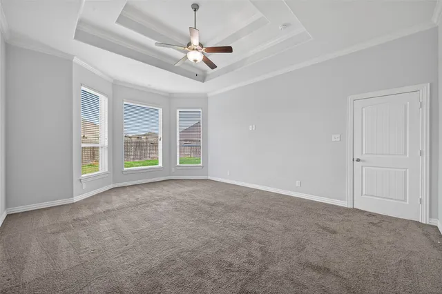 a spacious bathroom with a bathtub sink and mirror