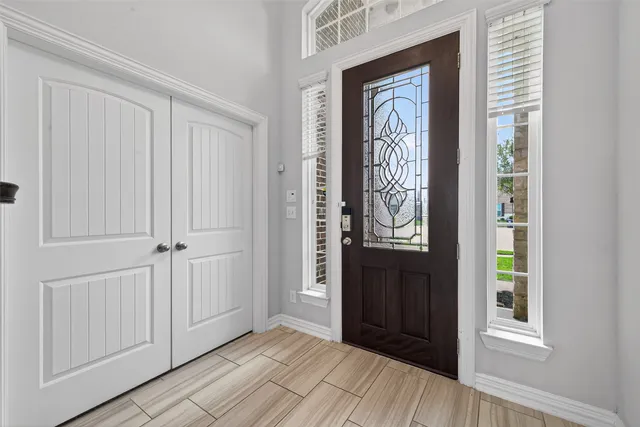 a view of front door with wooden floor